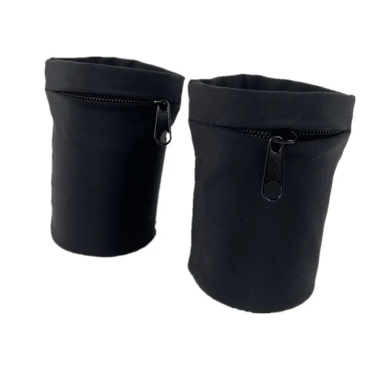 Black wrist sleeve bag with a mobile phone inserted, showing hands-free design on a person's wrist.