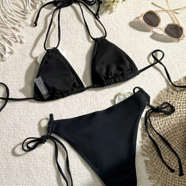 Black two-piece bikini with 3D flower lace detail and a split backless briefs design.