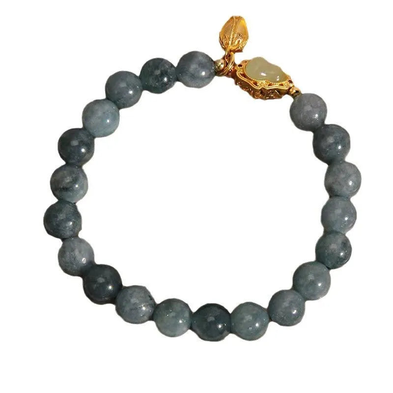 Natural stone bracelet for women with a blue electroplated gourd lotus flower pendant.
