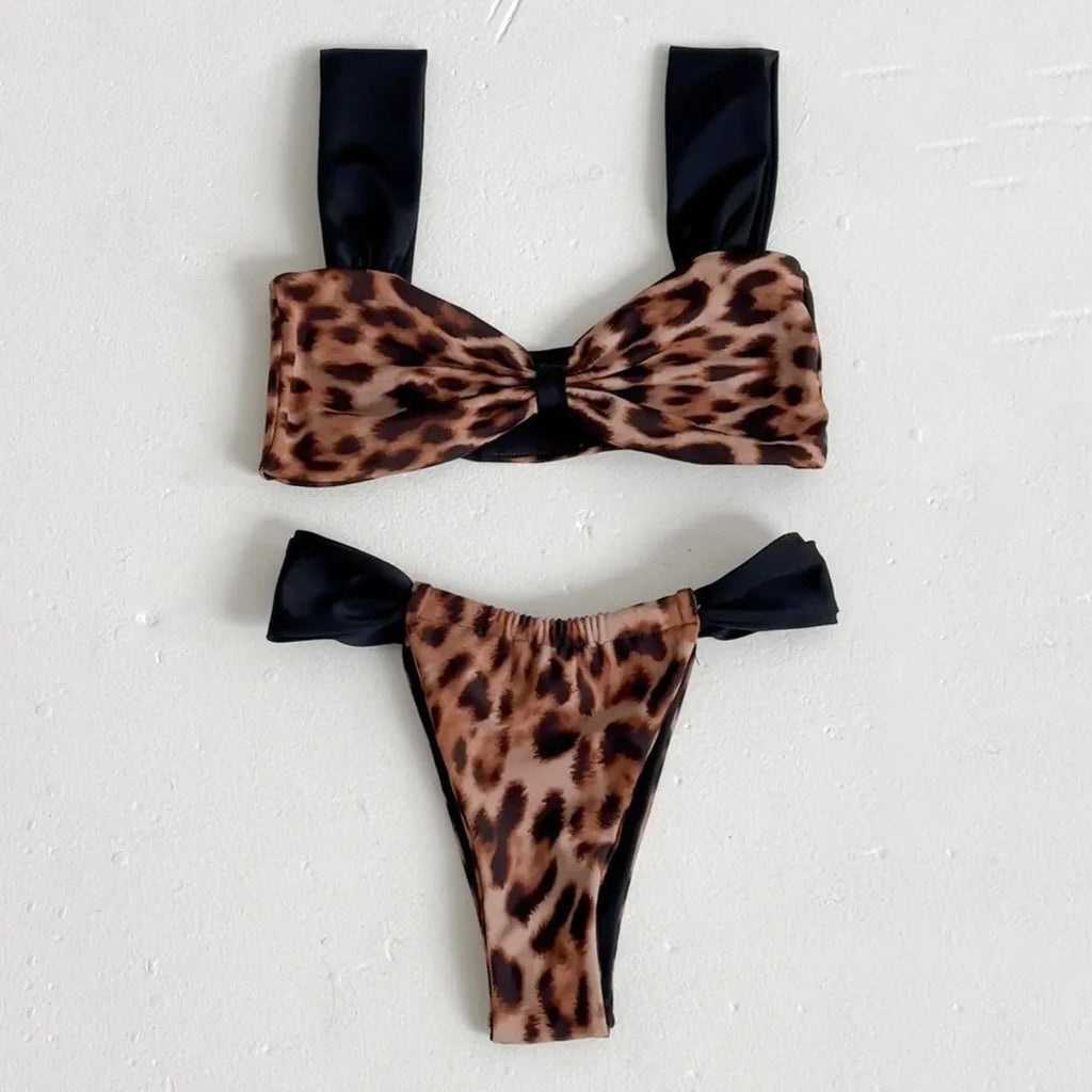 Women's leopard print bandeau bikini set with split top and T-pants bottoms.