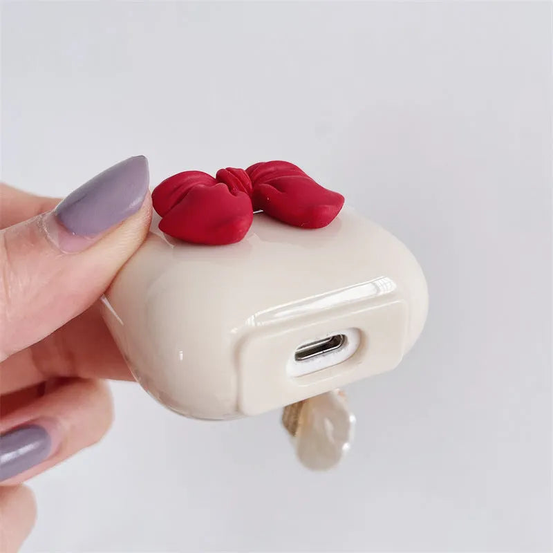 Beige red bow shell TPU clamshell case for AirPods Pro, AirPods 3, AirPods 1 and AirPods 2 wireless earphones