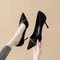 Women's black and gold stiletto pointed toe high heels with low cut design
