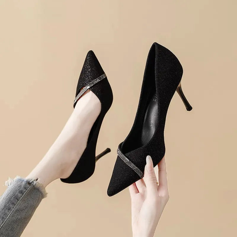 Women's black and gold stiletto pointed toe high heels with low cut design