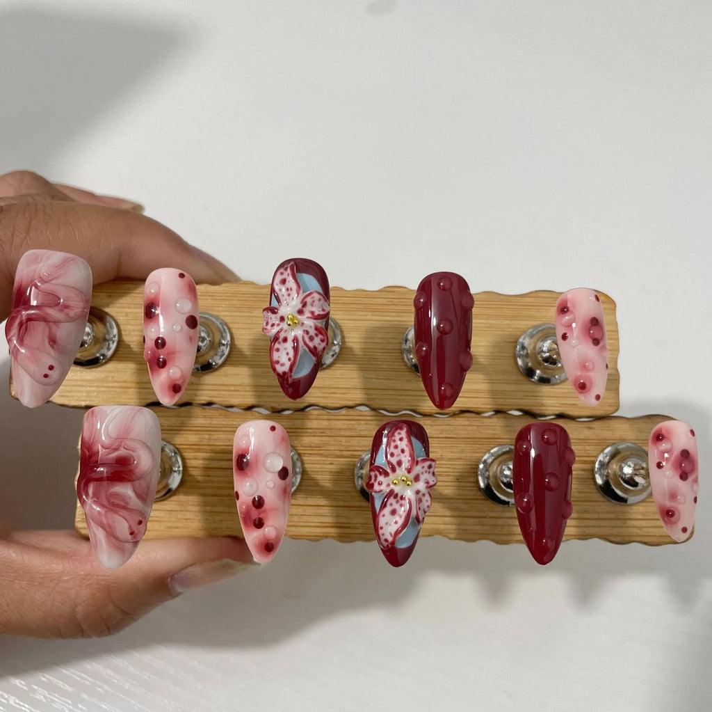 Hand-painted three-dimensional carved press-on nails in almond shape with rose, tulip, shell, bow, starry sky, butterfly, leopard print and XINGX patterns
