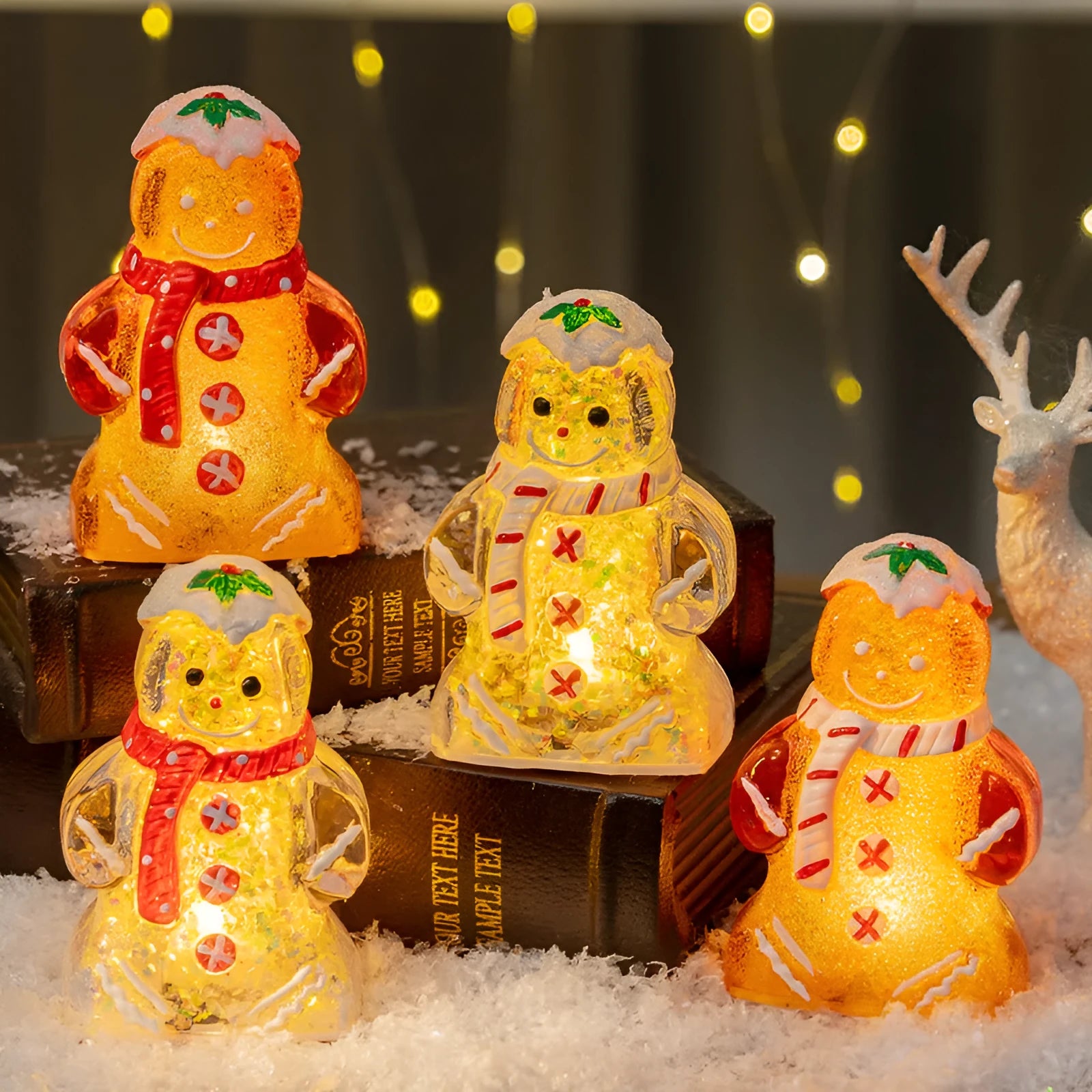 Glowing LED Christmas gingerbread man and snowman ornaments with removable scarves in different colours.