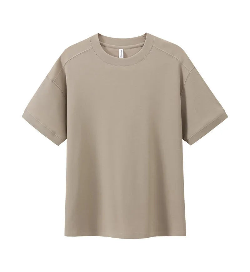 Breathable cotton pique short-sleeved T-shirt in a loose pullover style on a solid colour background.