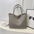 Woven PU shoulder bag for women in beige with double straps and medium-hard structure