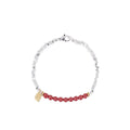 Silver-toned couple bracelet with geometric charm and round beads on white background
