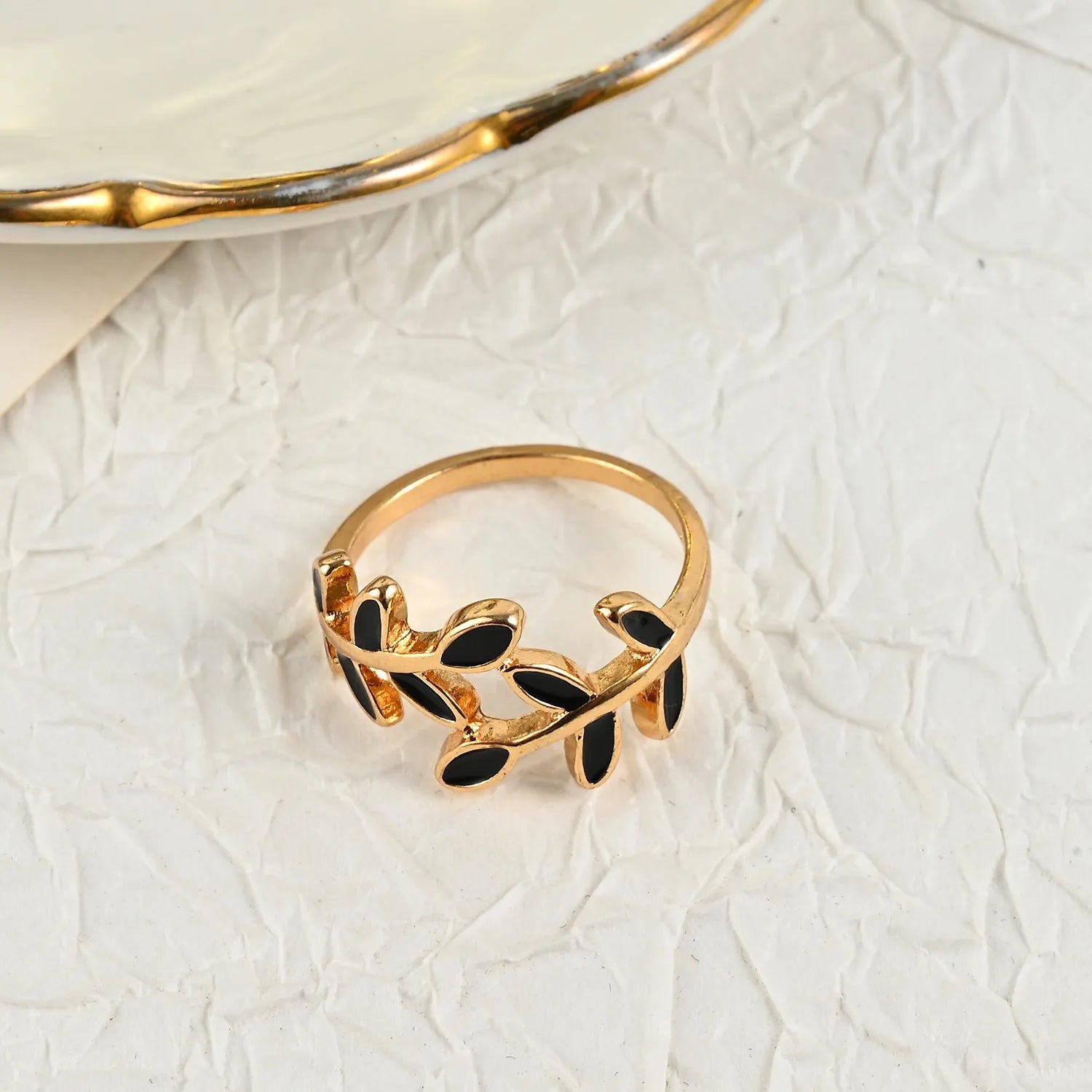 Gold geometric leaf design finger ring with floral elements and electroplated finish