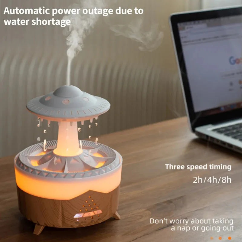 White UFO-shaped cloud humidifier with mist and soft blue night light on a wooden table