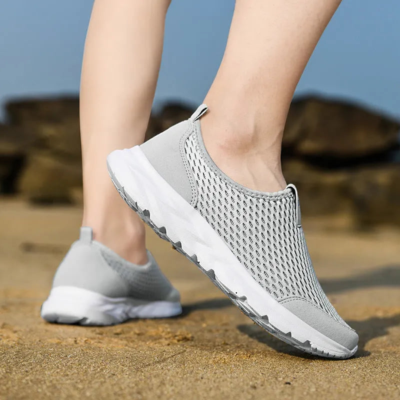Pair of couple casual mesh shoes with PU mesh upper, hollow plaid detailing, and flat rubber sole in light gray, dark blue, black and white, or all black.