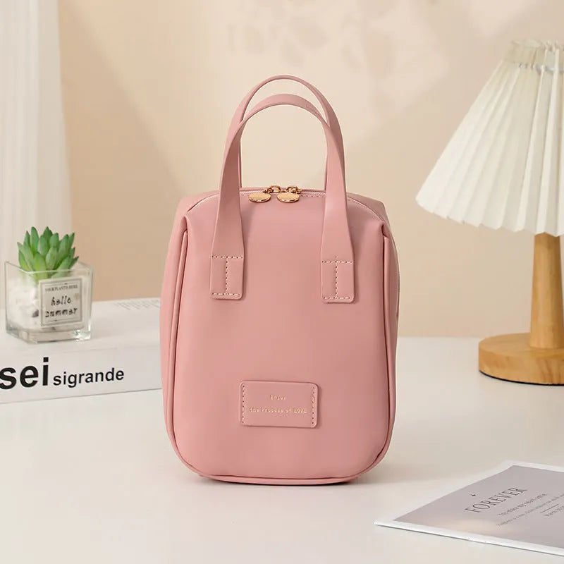 Handle-top cosmetic bag shell-shaped design in cream white with high capacity storage for travel and home use