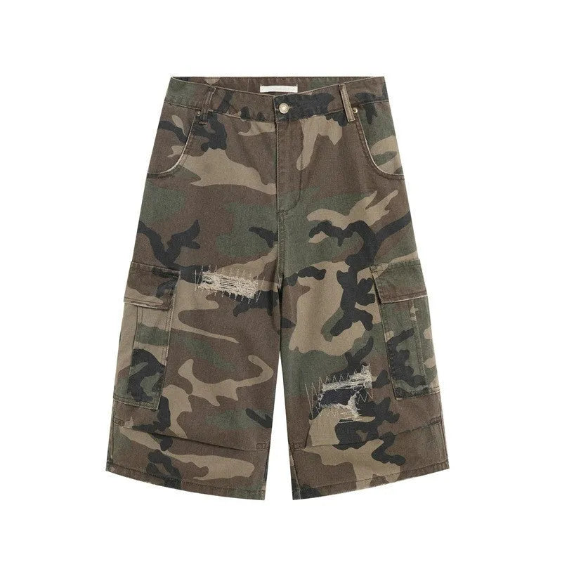 Men's retro patch ripped camouflage cropped jeans showing distressed detailing and straight leg design