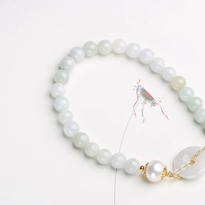 Jade green pearl bracelet with peace buckle fastening and round geometric pendant for women