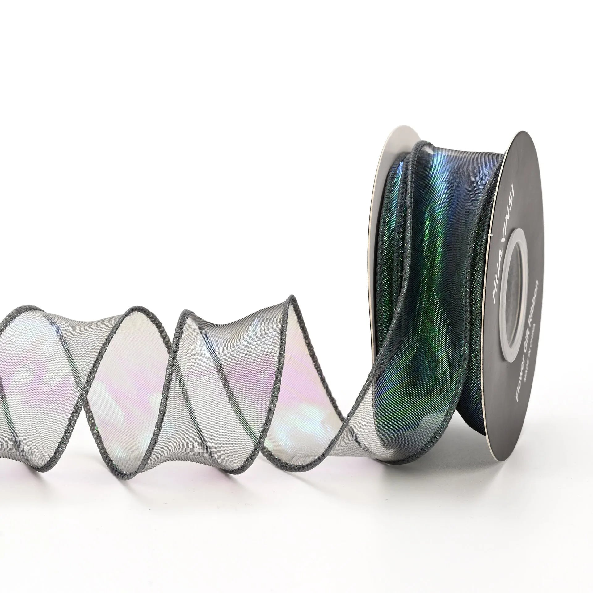 Roll of colourful wave patterned fishtail yarn decorative ribbon in mesh material, 4cm wide.