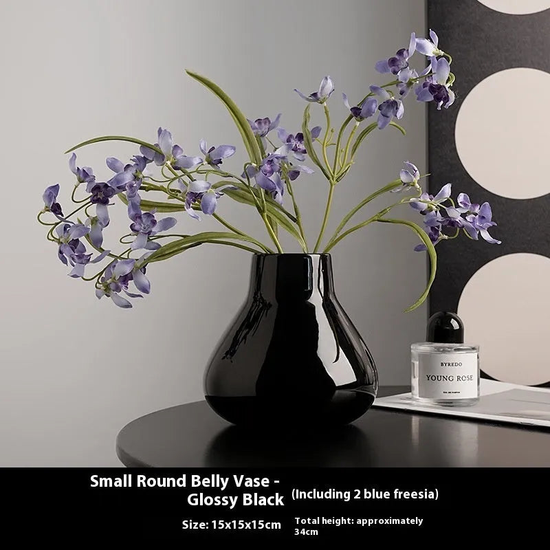 Black ceramic round belly vase with glass surface and coloured glaze decoration