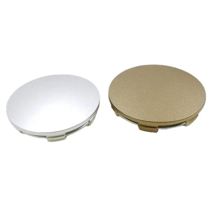 65mm diameter car wheel hub centre cap in antique copper finish with metal emblem.