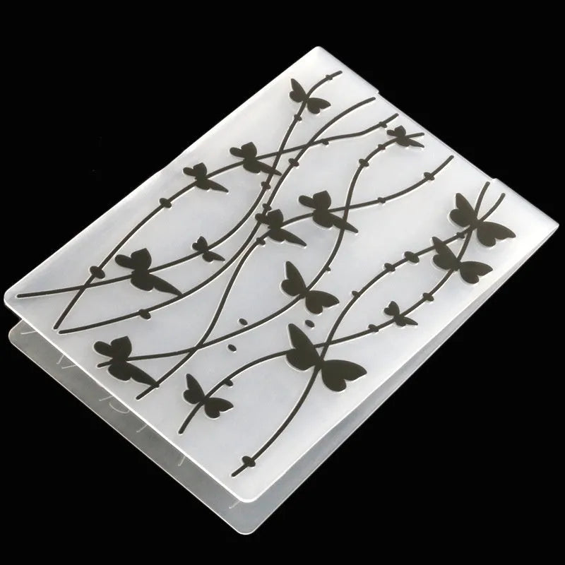 Plastic cake decorating mould showing windmill and flower shapes, folding size 14.5 by 10.5 cm.