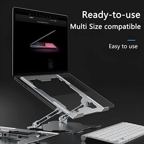 Grey aluminium adjustable and foldable laptop stand on a wooden desk.