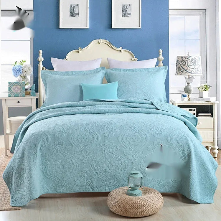 Double-sided pure cotton bed cover three-piece set in a light grey damascus pattern on a bed.