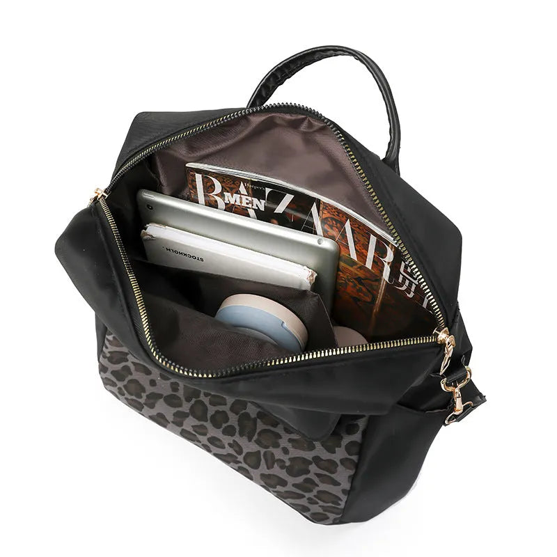 Leopard print women's large capacity nylon backpack in black, brown or beige with stitching and splicing.