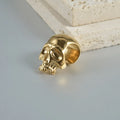 Stainless steel hollow skull and Buddha head geometric earrings in gold, black, steel, and Buddha finishes.