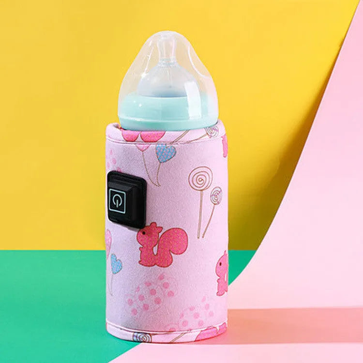 USB-powered baby bottle insulation cover in a blue dinosaur cartoon design.