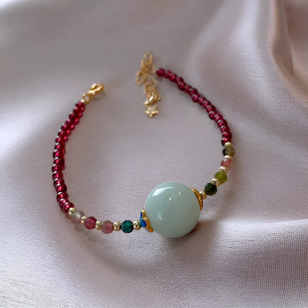 Simple aquamarine garnet bracelet with drop-shaped tourmaline stones and electroplated metal components
