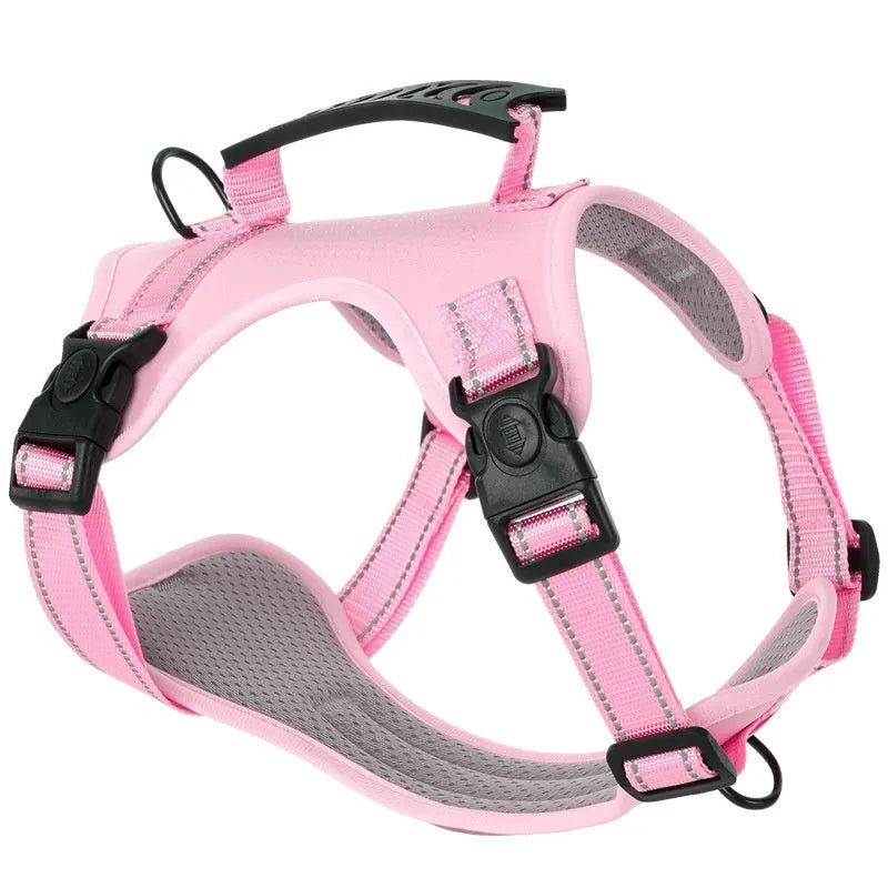 A black adjustable dog harness with a front chest D-ring, shown on a dog, demonstrating even strap placement.