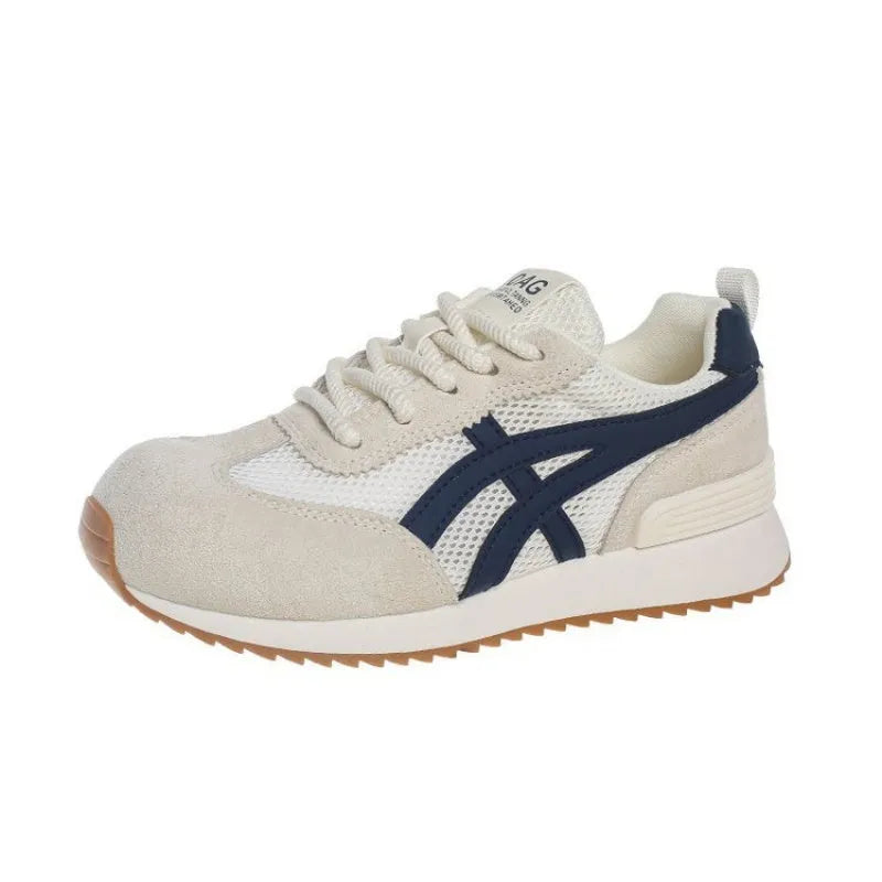 Women's white lace-up casual sneaker with round toe and flat heel on a non-slip sole.