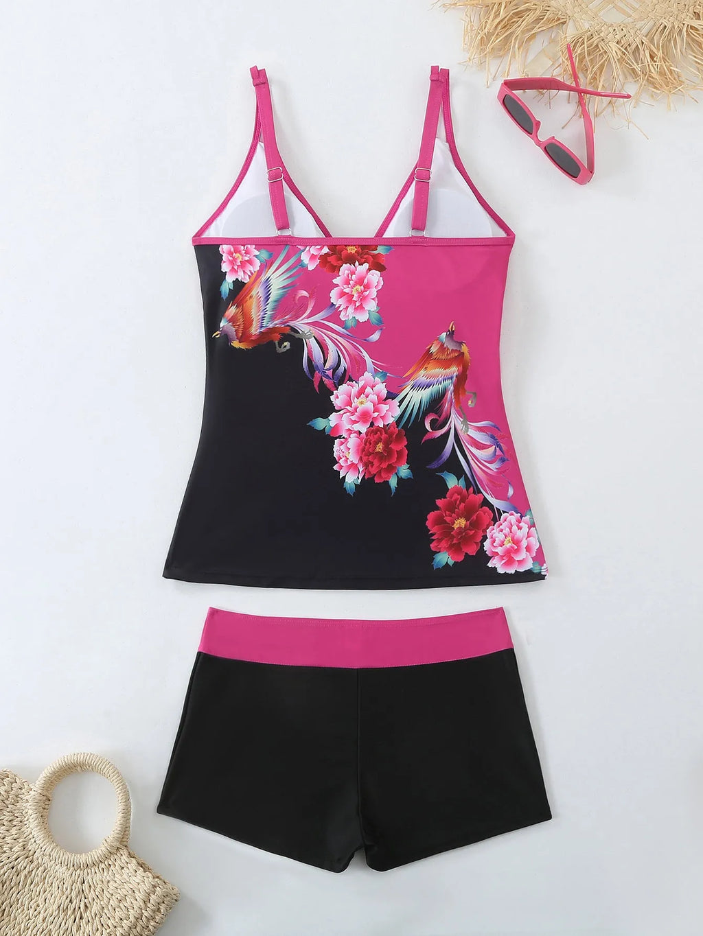 Plus size women's printed two-piece swimsuit in black or rose red with brief bottoms.