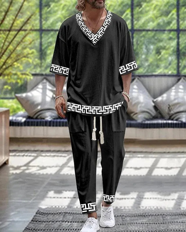 Lightweight cropped sleeve V-neck top and matching trousers suit in a solid colour.