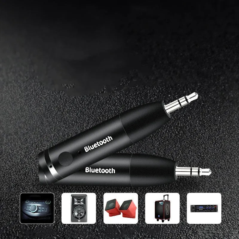 Black AUX Bluetooth 5.0 audio receiver for car or home stereo with USB cable.