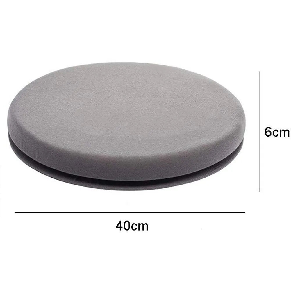 Grey rotating car seat cushion with a non-slip base on a car seat.