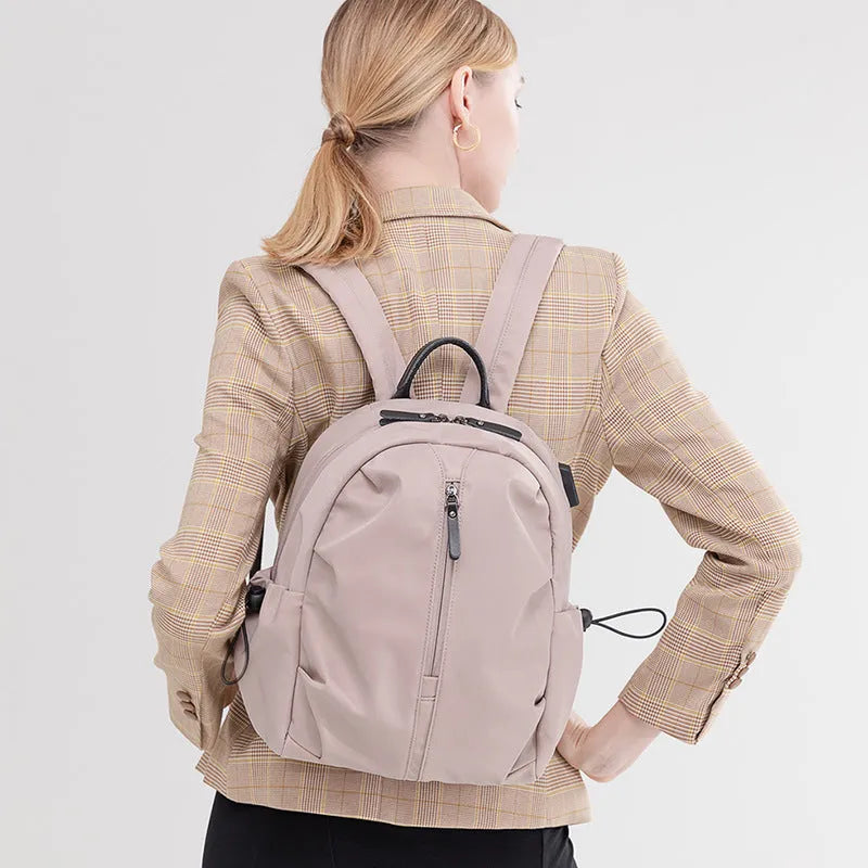 Women's Oxford cloth travel backpack with A4 and 14 inch sizes, multi-pocket interior, and sandwich pocket.