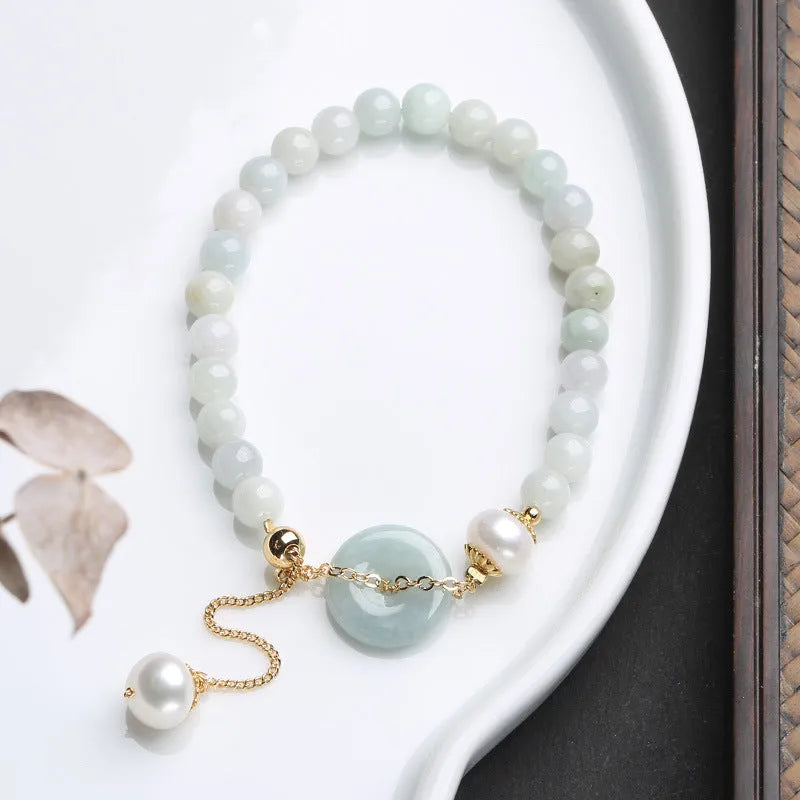 Jade green pearl bracelet with peace buckle fastening and round geometric pendant for women