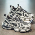 Men's black mesh sneaker with platform sole and lace-up front.