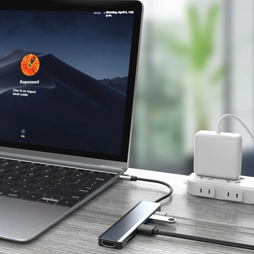 Seven-in-one Type-C USB expander hub with a short cable on a desk