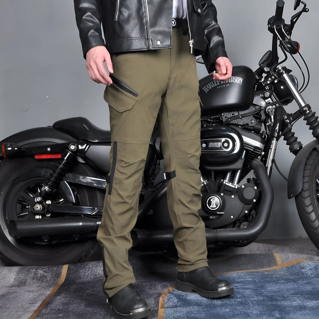 Men's green waterproof motorcycle trousers with belt and protective knee pads laid flat.