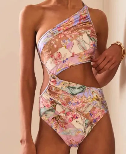 Women's rose gold patterned one-piece swimsuit on hanger