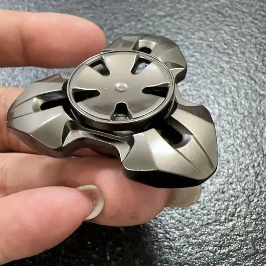 Alloy metal rotating fingertip gyro decompression toy in gun metal and colourful options