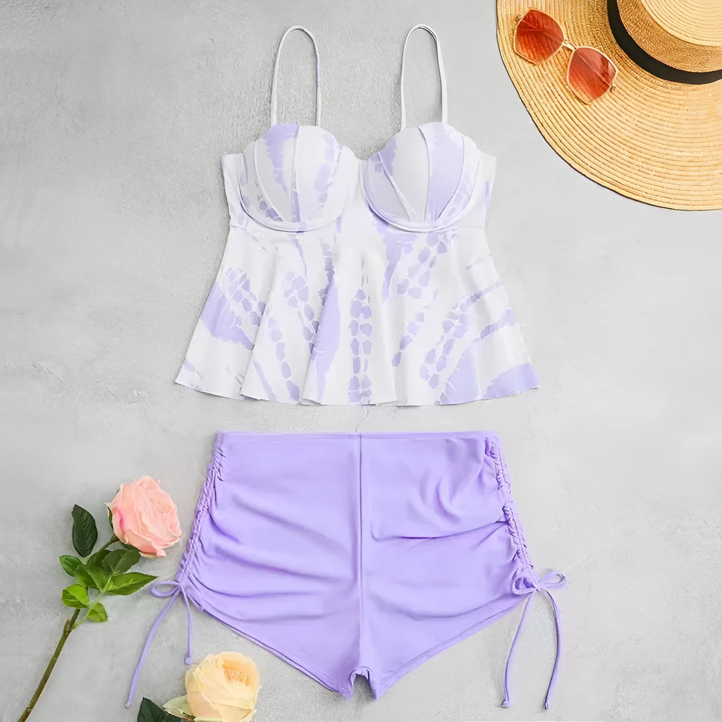 Women's blue printed bikini swimsuit top and shorts set on a mannequin.