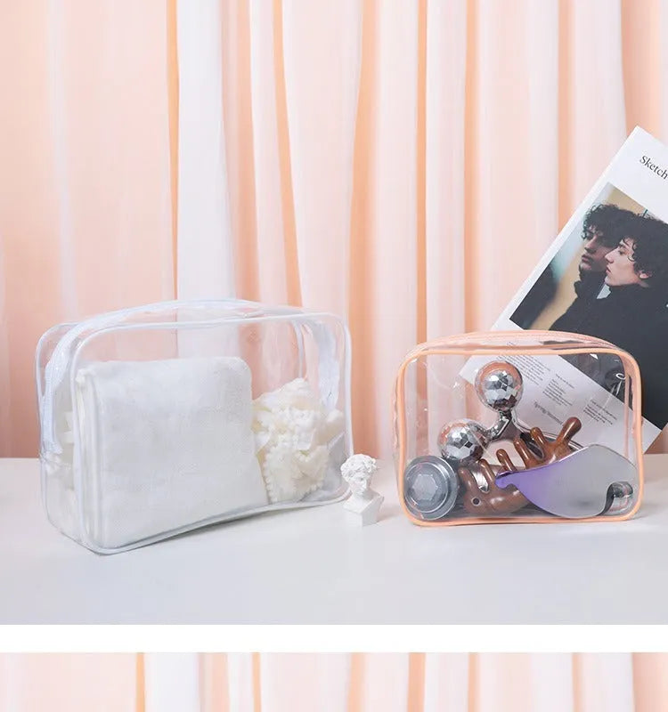 PVC transparent makeup bag in semi-transparent black, pink and white colours with zip closure