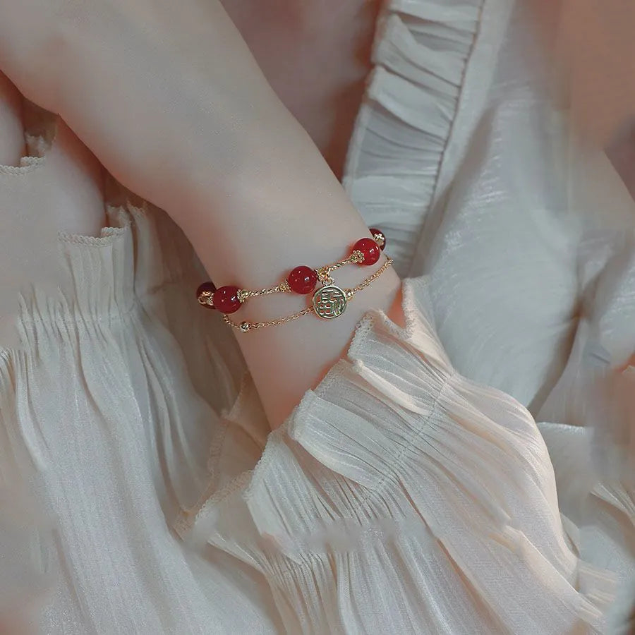 Red agate and alloy double-layer women's bracelet with Hongma lucky charm pendant on wrist