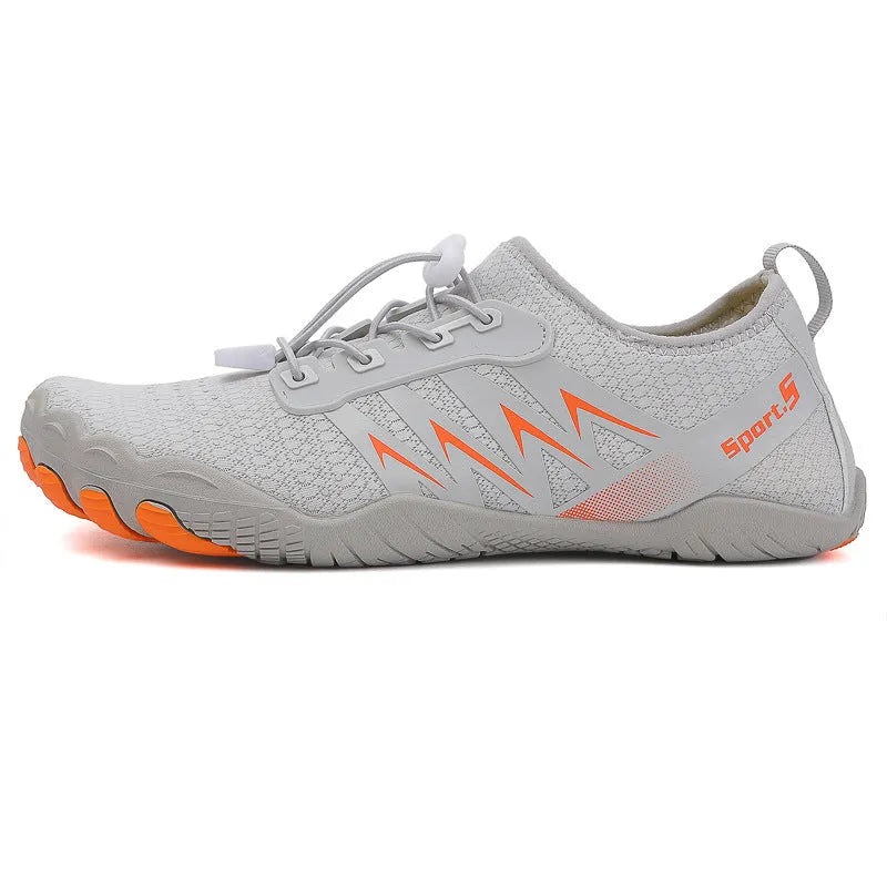 Low-top river tracing shoes in apricot colour with mesh upper and rubber sole.