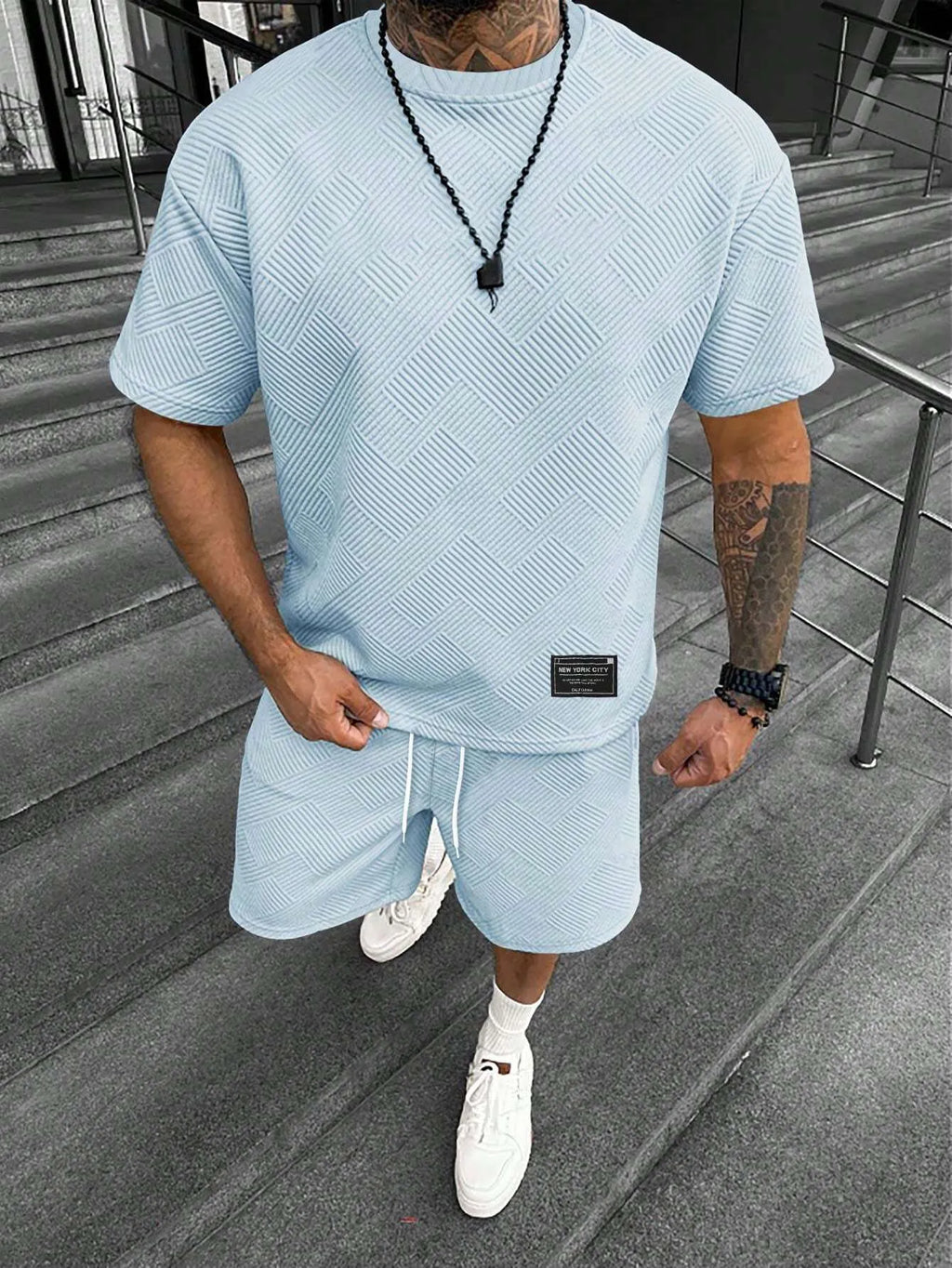 Men's short sleeve top and shorts suit with 3D printed pattern for sport and leisure wear.