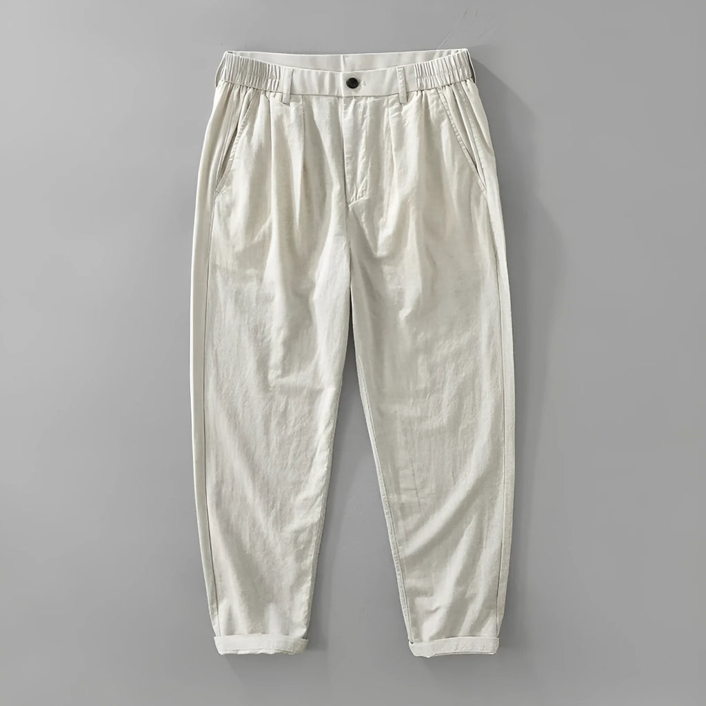 Man wearing loose straight-leg cotton linen blend trousers in a casual setting