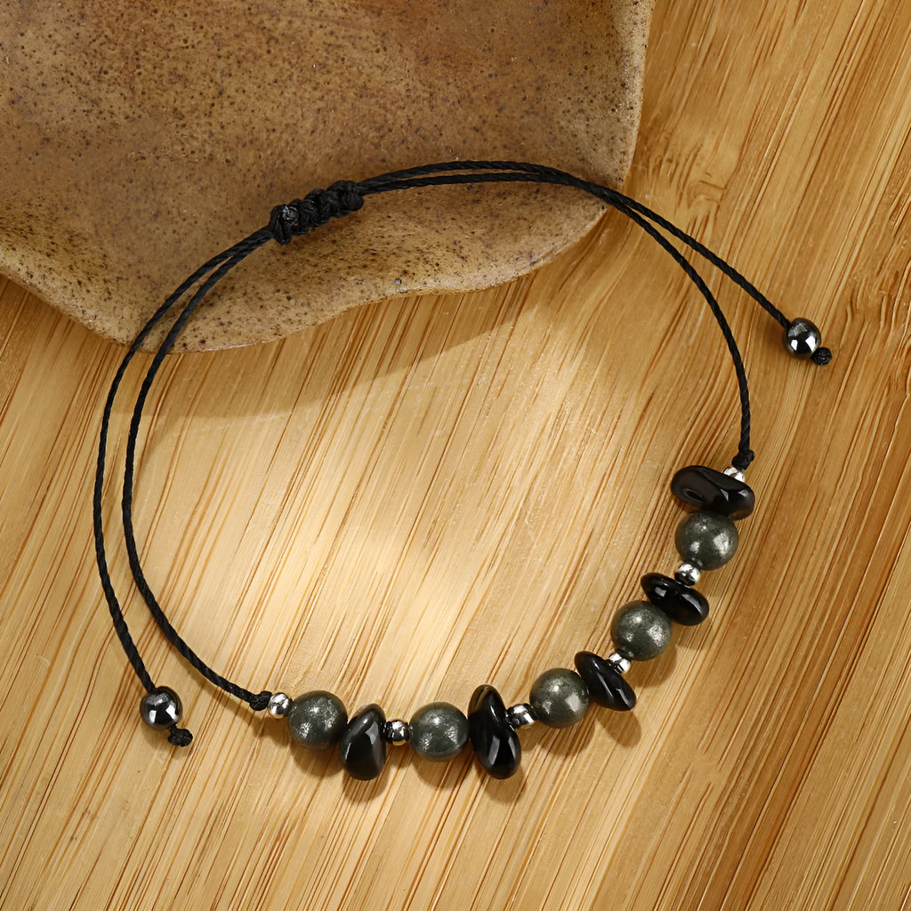 Black garnet geometric stone bracelet with moon charm on wrist