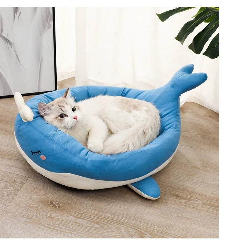 Blue duck-shaped fluffy pet bed for a small dog, showing raised rim and soft material.