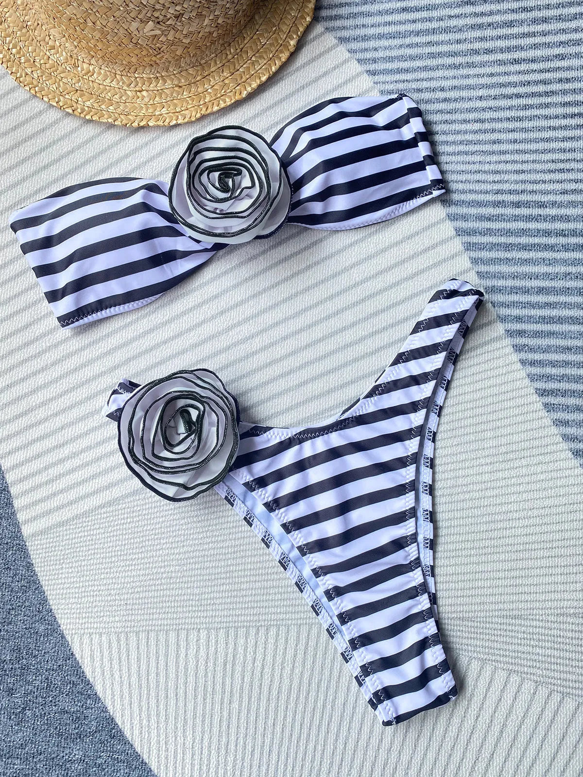 Black and white striped bikini swimsuit with a cross-border tube top, three-dimensional flower detail, and matching shorts.